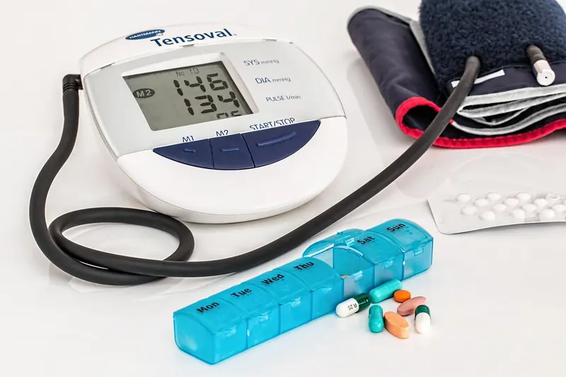A blood pressure monitor and a pill organiser